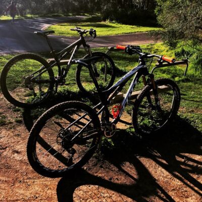 two bikes parked in Westerfolds Park near the start of Hans Loop mtb trail