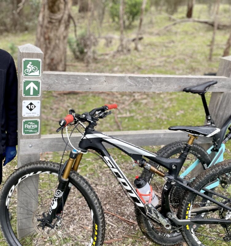 Two mountain bikes at the top of the Comm Games mtb trail at Lysterfield mtb park