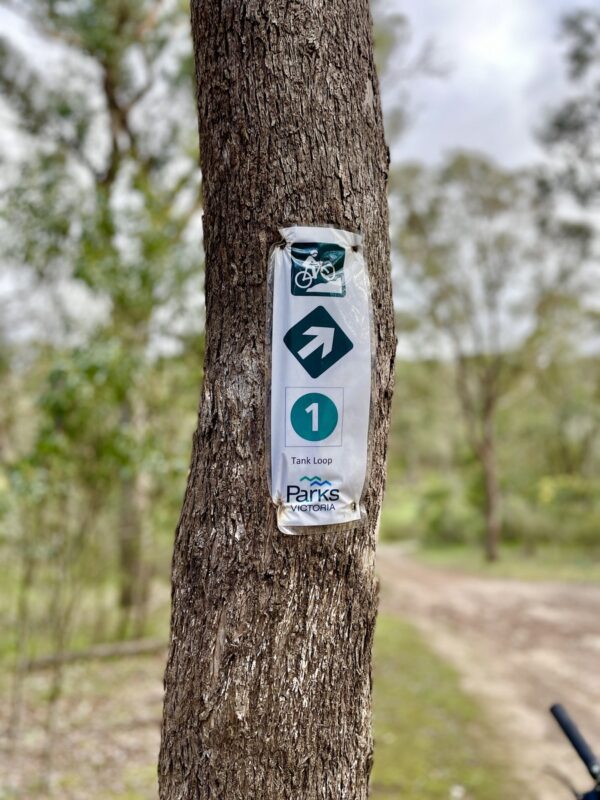 Trail signage on tree at the Plenty Gorge mtb trails.