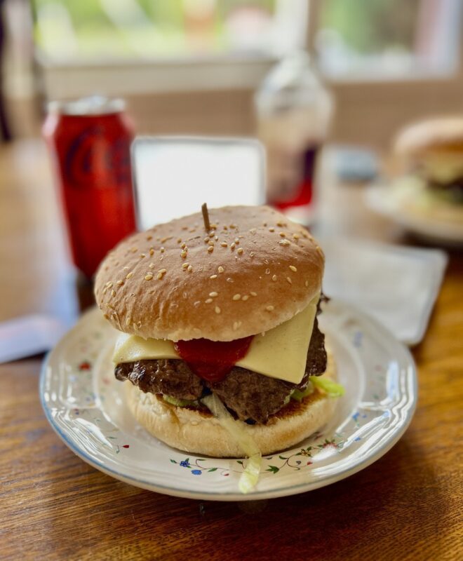 Cheese burger on table at Igloo Roadhouse after riding at Buxton mtb trails