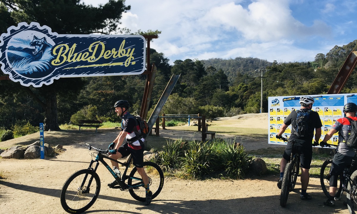 Mountain Bike riders in front of trailhead at Derby, Tasmania bike park.