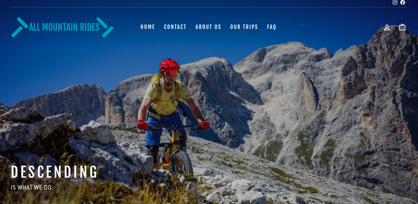 Screenshot of home page of All Mountain Rides mtb trip operator with rider and large mountain face in background