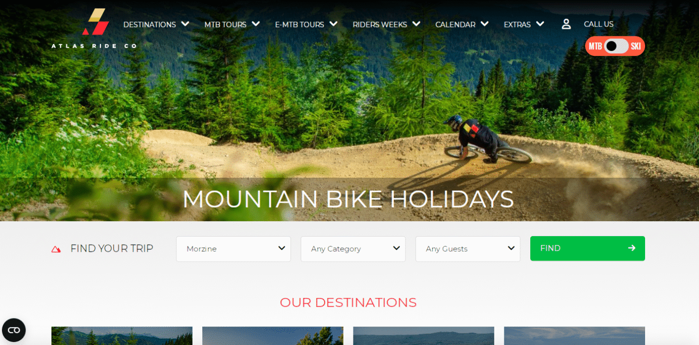 Screenshot of home page of Atlas Bike Co. mountain bike tour operator with rider on a high berm with green foilage in background