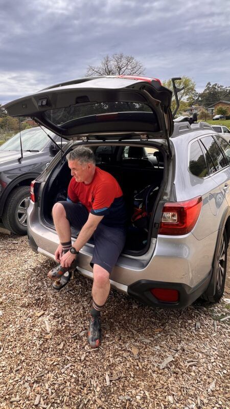 rider getting ready in back of car at Creswick mountain bike park trailhead