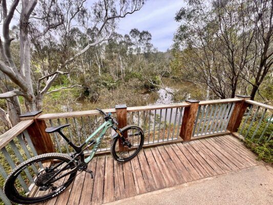Lookout with view of the Yarra River along the Yarra MTB trails with bike in foreground.
