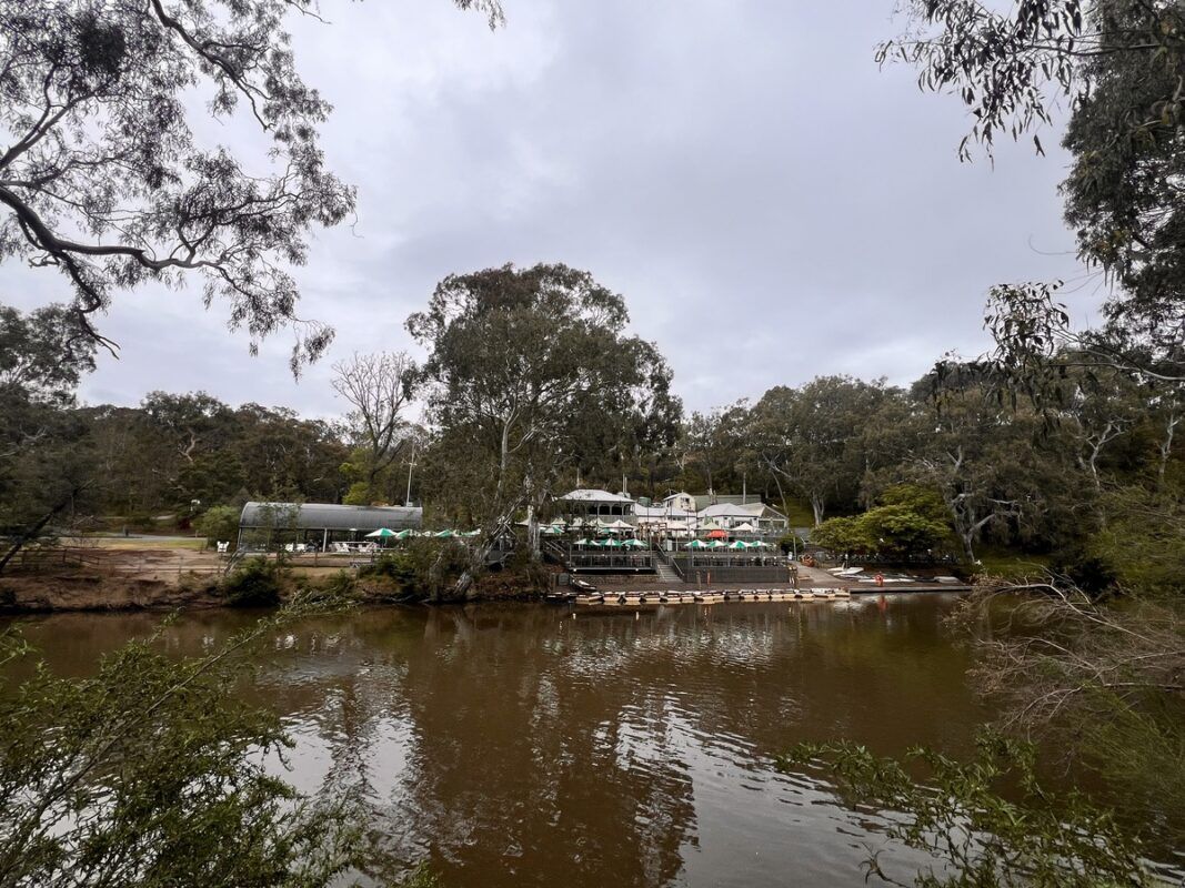Image of the Studley Park boathouse from across the river along the Yarra Trails mtb route.